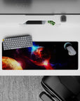 Cinematic deep-space mouse pad 32x12 inches in inky black with violet dust and electric blue streaks.