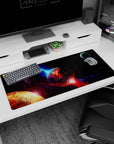 Cracked lava planet scene desk pad 36x16 inches with fiery red-orange fissures and a watching moon.