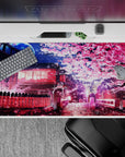 Enchanting 40x20 deskmat transforms your workspace with a magical nighttime sakura street, blending wonder and tranquility under a radiant moon