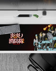 36x16 inches anime desk pad in deep charcoal with turquoise bands, glowing kanji, warm flame spirits.