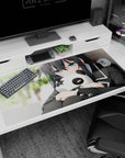 Shy anime schoolgirl hugging a panda plush on a 40x20 inches desk pad with blurred green background.