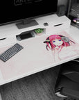 Nino Nakano from The Quintessential Quintuplets on a 40x20 inches desk pad, mischievous pose and bright eyes.