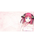 Anime girl desk pad 40x20 inches with Nino Nakano on soft pink scribble background, white dress and ribbons.