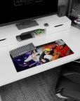 Anime mouse pad featuring Naruto and Sasuke, size 28x12 inches, showcasing Kurama and Susanoo in dynamic red and purple.