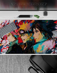 Anime desk pad 40x20 inches featuring Team 7—Sakura, Naruto, Sasuke—in dynamic sketch-art; vibrant colors and textures.