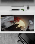 Dynamic 32x16 desk mat combines crimson tones, misty shadows, and moonlight for impactful visuals