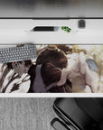 36x16 inches anime desk pad in tan sand tones with deep shadows and sharp green eye, intense vibe.