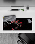 28x12 inches mouse pad with plum blossoms, showcasing the vivid red flowers and snow-covered branches, symbolizing resilience and hope in winter.
