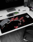 Large 40x20 inches desk pad featuring plum blossoms, blending snow-covered branches with vivid red flowers for a beautiful contrast of nature and art.