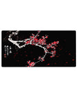 Mouse pad featuring plum blossoms, 32x16 inches, with snow-covered branches and vivid red flowers for a striking, hopeful contrast in nature and art.