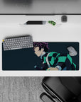 Anime mouse pad featuring Tanjiro from Demon Slayer, showcasing his teal-black haori on navy-blue background, size 32x12 inches.