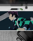 Tanjiro Demon Slayer anime desk pad 40x20 inches featuring his teal-black haori against a navy-blue background.