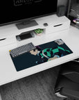 Anime mouse pad featuring Tanjiro from Demon Slayer, 28x12 inches, with a teal-black haori against a navy-blue background.