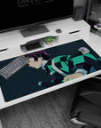 Tanjiro anime desk pad, 40x20 inches, featuring teal-black haori on navy-blue background for focused workspace.