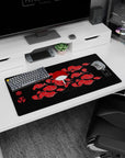 Modern 32x16 inches mouse pad featuring Uchiha Clan design, with Uchiha fan, red clouds, and Sharingan symbols on a bold black background for strength.