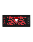 Mouse pad featuring Uchiha Clan design, 28x12 inches, with fiery red clouds, Sharingan symbols, and Uchiha fan for a minimalist, bold aesthetic.