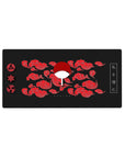 Mouse pad featuring Uchiha Clan design, 32x16 inches, with Sharingan symbols, Uchiha fan, red clouds, and a black background for a powerful aesthetic.