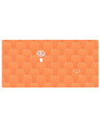 32x16 inches anime mouse pad with repeating orange hamsters and a smiling girl popping up on a desk pattern.