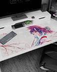 Blue-haired anime girl blushing and side-glancing under an umbrella on a 40x20 inches desk pad.