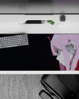 Mysterious 36x16 anime desk mat with enigmatic smirk and piercing teal eyes, dark gradient for bold contrast