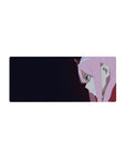 Sleek 28x12 mouse pad featuring bold anime art with piercing teal eyes and enigmatic smirk against dark gradient