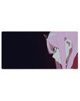 Close-up 32x16 anime mouse pad with piercing teal eyes and enigmatic smirk, sleek dark gradient backdrop