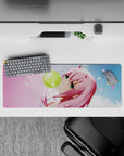 Pastel-colored 32x12 mouse pad featuring whimsical anime design with floating petals and bubblegum pop style