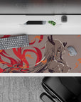 36x16 inches anime girl desk pad in soft gray with crimson flame curls and orange sparks, cozy-danger mood.