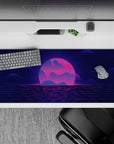 Striking 36x16 desk pad highlights pixelated waters, neon gradients, and glowing details in stunning retro artistry
