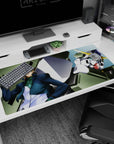 Lockon Stratos leaning cool beside Gundam Dynames, anime desk pad 40x20 inches under pale sky.