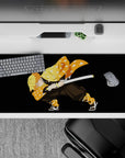 Anime desk pad 36x16 inches featuring Zenitsu from Demon Slayer in a fierce pose, vibrant orange haori, and sword drawn.