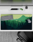 32x16 inches mouse pad with forest explorer, featuring lush valley and distant peaks for a calming, adventurous effect.