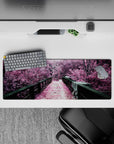 Intense 32x12 desk mat features rustic bridge and lush trees with intricate details for fans of surreal beauty