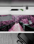 Striking 36x16 desk pad highlights lush trees, rustic bridge, and soft pink tones in stunning artistic detail