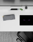 Moody violet-eyed anime mouse pad 14x10 inches in deep blacks with sharp orange-brown streak accents.