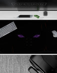 Moody black anime desk pad 40x20 inches with cold violet Rinnegan glow and sharp orange-brown accents.