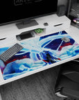 Silver-haired warrior in layered robes on anime desk pad 40x20 inches, fox spirit arcing behind him.