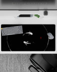 Dynamic 32x16 mouse pad combines deep black tones and soft brushstrokes for impactful yet soothing visuals