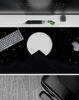 Serene 40x20 desk pad with a glowing full moon and shadowy mountain peak, perfect for creating a peaceful and captivating workspace