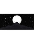 Serene 36x16 desk pad with a glowing full moon and shadowy mountain peak, creating a calming and captivating vibe for your workspace