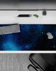 Navy-to-black cosmic gradient desk pad, 36x16 inches, calm and dreamy with tiny sparkling starbursts.
