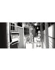 36x16 inches anime girl desk pad with manga line art of a shy girl in a gritty apartment hallway.