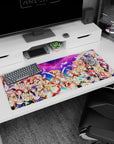 Honoka Kousaka, Kotori Minami, and Umi Sonoda anime girl desk pad in a group-hug scene, 36x16 inches.