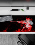 Red-on-black anime girl desk pad 36x16 inches with crimson splashes and smoky streaks, edgy vibe.