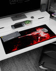 Anime girl kneeling with long sniper rifle desk pad 36x16 inches, fiery hair whipping in motion.