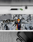 Black-and-white manga backdrop with bright orange hair and navy accents, Haikyuu desk pad 36x16 inches.