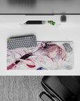 28x12 inches anime desk mouse pad in pale pink, milky white, smoky gray tones with bold black blade accents.