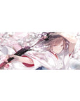Anime girl desk pad 36x16 inches with katana and drifting sakura petals, shrine-maiden style artwork.