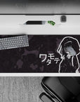 Moody charcoal camo anime desk pad 36x16 inches, crisp white outlines and sleepy deadpan vibe.