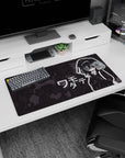 Tomoko Kuroki in an oversized hoodie anime mouse pad 32x16 inches, tiny fangs and tired stare.